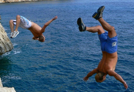 A photo of people flipping into water